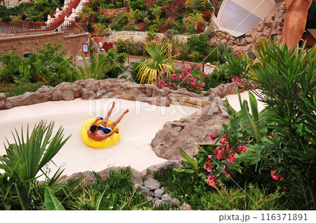 The tourists enjoying water attractions in Siam waterpark, Tenerife, Spain The tourists enjoying water attractions in Siam waterpark, Tenerife, Spain 116371891