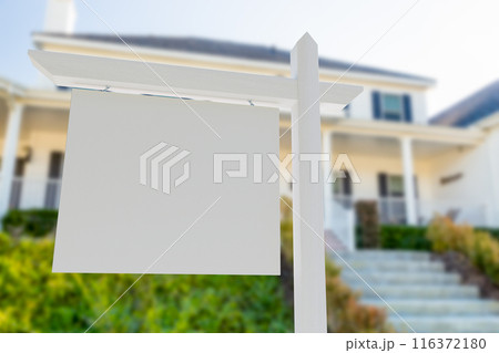 Blank Real Estate Sign in Front of Beautiful House. 116372180