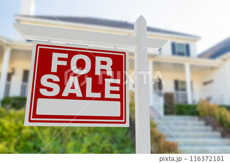 For Sale Real Estate Sign in Front of Beautiful House. 116372181