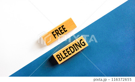 Free bleeding symbol. Concept words Free bleeding on beautiful wooden block. Beautiful white and blue background. Gen Z, motivational freedom free bleeding concept. Copy space. 116372655