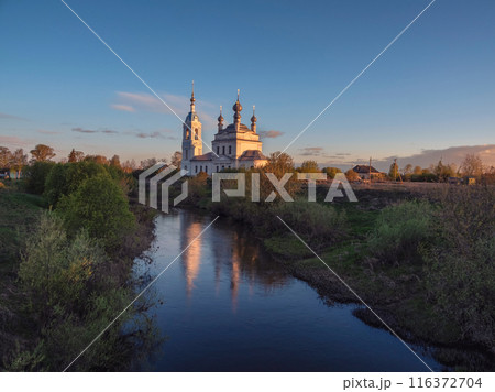 Morning landscape, sunrise on the river with monastery. 116372704