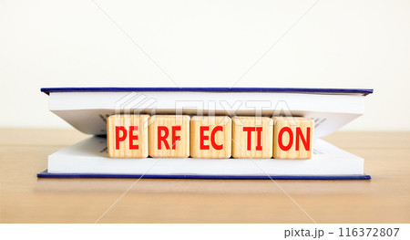 Perfection symbol. Concept word Perfection on beautiful wooden cubes in book. Beautiful wooden table white background. Business perfection concept. Copy space. 116372807