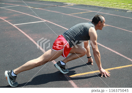 The Body Of A Professional Runner Stretching  116375045