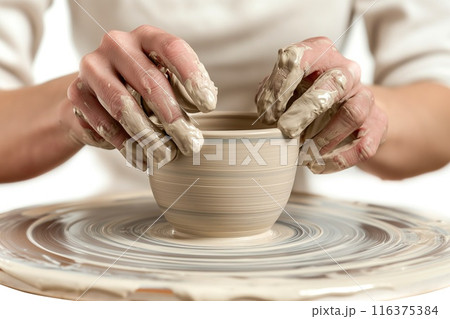 Hands of girl creating bowl on potter's wheel. 116375384
