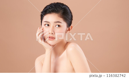 Beautiful young asian woman with clean fresh skin on beige background, Face care, Facial treatment, Cosmetology, beauty and spa, Asian women portrait. 116382742