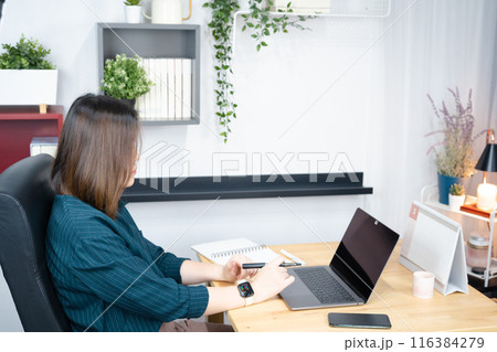 asian woman use laptop for working her business from home 116384279