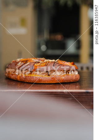 Isolated traditional coke with chocolate and dehydrated fruit on a table. Vertical 116385947