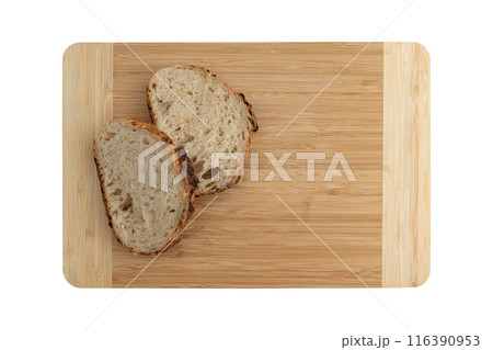 slices wheat bread on wooden board, top view 116390953
