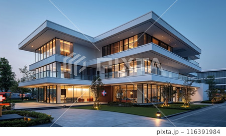 modern hospital style building with blue cross 116391984