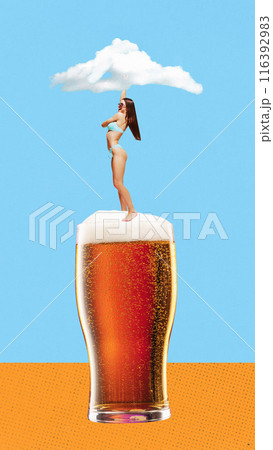 Young smiling woman in swimsuit dancing on lager froth bee again abstract blue background with single cloud. Contemporary art collage. 116392983