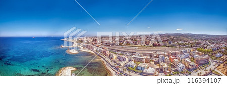 Drone panorama over the Italian city of Civitavecchia with harbor and cruise ships during the day Drone panorama over the Italian city of Civitavecchia with harbor and cruise ships during the day 116394107