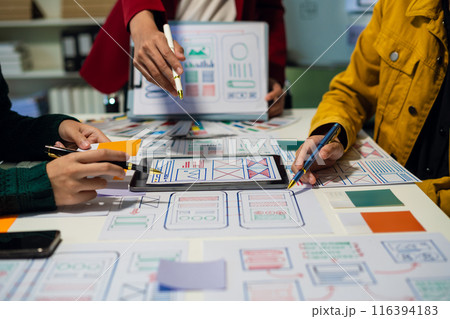 Creative team web designer feel happy work complete Teamwork planning application, success at work in the office concept. Creative team web designer feel happy work complete Teamwork planning application, success at work in the office concept. 116394183