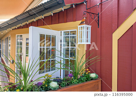 Entrance of a street cafe decorated with flowers Entrance of a street cafe decorated with flowers 116395000