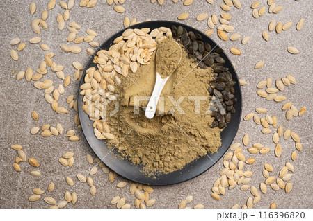 Flour from ground fresh pumpkin seeds, a superfood, a plant-based source of protein and vitamins. Flour from ground fresh pumpkin seeds, a superfood, a plant-based source of protein and vitamins. 116396820