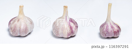Three unpeeled fresh bulbs of garlic on a white isolate background 116397291