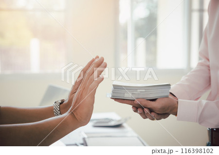 Business man refusing money to take the bribe. The concept of corruption and anti bribery. Business man refusing money to take the bribe. The concept of corruption and anti bribery. 116398102