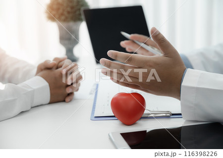 Doctor explaining heart to patient about details and risks operation. Healthcare and medical concept. Physician explaining health exam to patient. 116398226