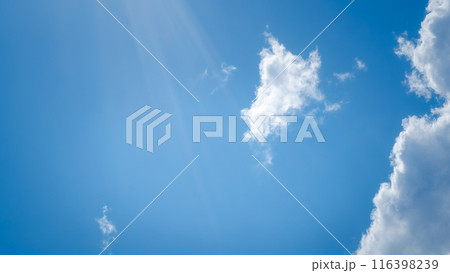White clouds on the blue sky perfect for the background. Clear blue sky and white clouds. Blue sky background with clouds. White clouds on the blue sky perfect for the background. Clear blue sky and white clouds. Blue sky background with clouds. 116398239