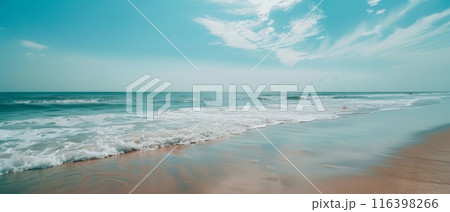 A tranquil beach under a clear sky, the gentle waves whispering to the sandy shore. The vastness of the sea mirrors the infinite blue above, evoking a sense of peace. 116398266