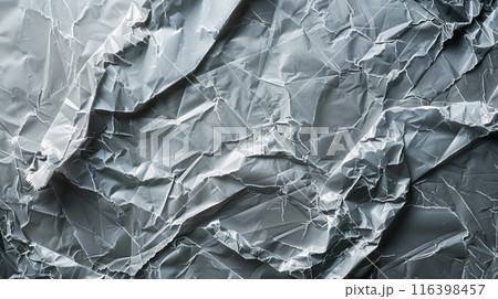 Shiny Crumpled Aluminum Foil Background Texture with Metallic Silver Wrinkles and Reflections 116398457