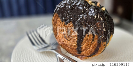 Delicious Cromboloni or Crombolini, croissant Bomboloni round New York Roll with Chocolate or caramel sauce pastry perfect for dessert recipe multimedia content 116399115