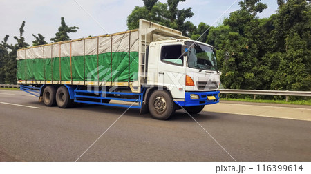 truck one of transportation mode making local commercial delivery at urban city and on the city streets in asia logistical transport system 116399614