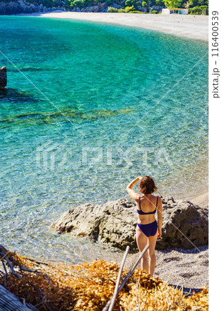 Woman on beach enjoying vacation 116400539