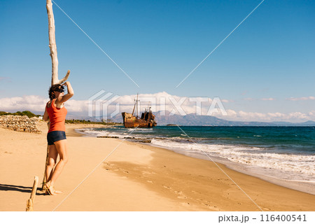 Tourist woman on beach enjoying vacation 116400541
