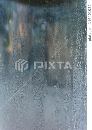 Closeup shot of a steamy window with water drops 116401020