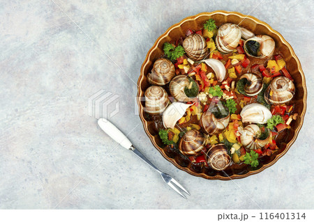 Edible stuffed snails 116401314