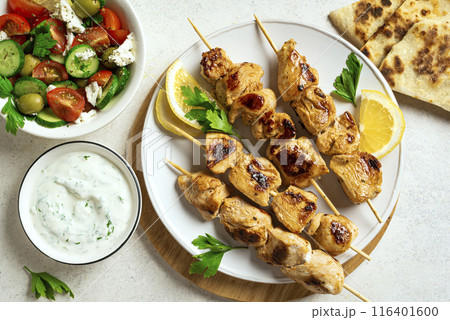 Chicken skewers and greek tzatziki sauce Chicken skewers and greek tzatziki sauce 116401600