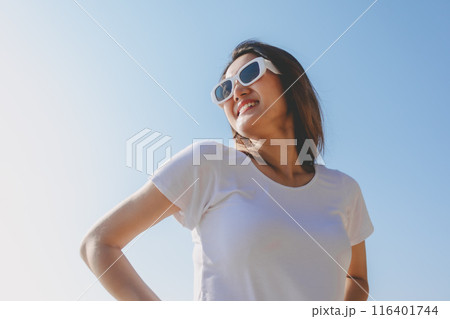 Happy woman enjoy taking photo on sunny beach. Thailand. Happy woman enjoy taking photo on sunny beach. Thailand. 116401744