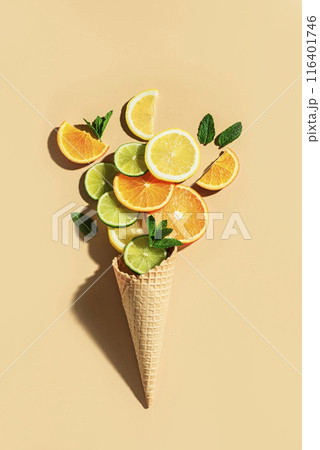 waffle cone and citrus fruit slices 116401746
