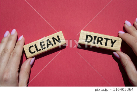 Clean or Dirty symbol. Concept word Clean or Dirty on wooden blocks. Man hand. Beautiful red background. Gender and Clean or Dirty concept. Copy space 116403364