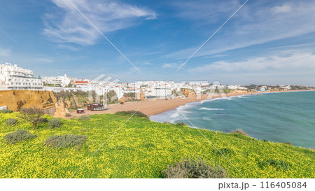 Wide sandy beach and Atlantic ocean in city of Albufeira timelapse. Algarve, Portugal Wide sandy beach and Atlantic ocean in city of Albufeira timelapse. Algarve, Portugal 116405084