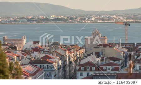 Aerial view of Lisboa downtown timelapse during sunset. Panoramic of Baixa, Rossio and Chiado red rooftops from above. Portugal 116405097