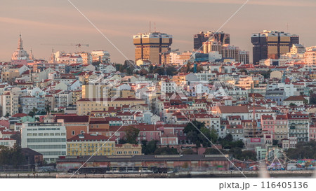 Aerial view of Lisbon skyline with Amoreiras shooping center towers timelapse from Almada at sunset. Lisbon, Portugal Aerial view of Lisbon skyline with Amoreiras shooping center towers timelapse from Almada at sunset. Lisbon, Portugal 116405136
