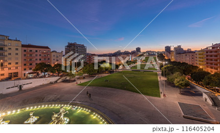 Panorama showing lawn at Alameda Dom Afonso Henriques and the Luminous Fountain aerial day to night timelapse in Lisbon. Panorama showing lawn at Alameda Dom Afonso Henriques and the Luminous Fountain aerial day to night timelapse in Lisbon. 116405204