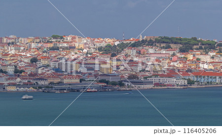 Aerial view of Lisbon over Tagus river from viewpoint of Cristo Rei in Almada with yachts tourist boats timelapse. Lisbon, Portugal Aerial view of Lisbon over Tagus river from viewpoint of Cristo Rei in Almada with yachts tourist boats timelapse. Lisbon, Portugal 116405206