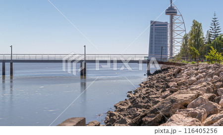 Motion from the low to high tide next to Vasco da Gama Bridge in Parque das Nacoes timelapse in Lisbon, Portugal. Motion from the low to high tide next to Vasco da Gama Bridge in Parque das Nacoes timelapse in Lisbon, Portugal. 116405256