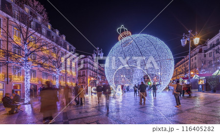Panorama showing Christmas decorations with big ball on Luis De Camoes square night timelapse. Panorama showing Christmas decorations with big ball on Luis De Camoes square night timelapse. 116405282