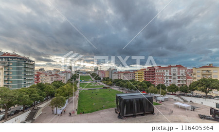 Panorama showing aerial view of Jardim da Alameda in Lisbon with the Luminous Fountain timelapse during sunset. 116405364