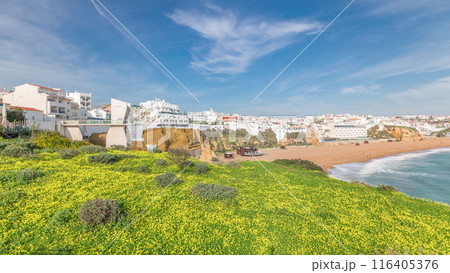 Wide sandy beach and Atlantic ocean in city of Albufeira timelapse. Algarve, Portugal Wide sandy beach and Atlantic ocean in city of Albufeira timelapse. Algarve, Portugal 116405376