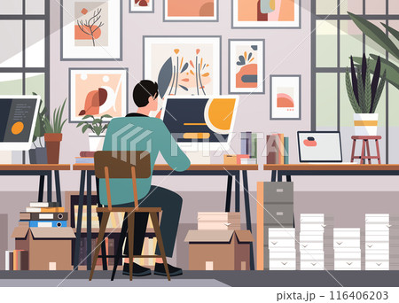 Person working at desk in creative office workspace with plants books and wall art modern interior design 116406203