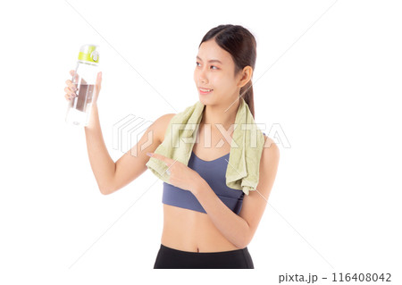 Fit young asian woman taking a break from workout holding clear water bottle. 116408042