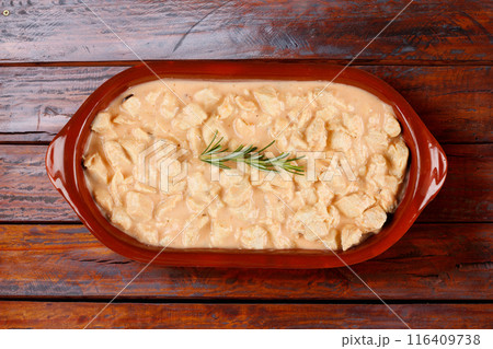 homemade chicken stroganoff in ceramic bowl on rustic wooden table 116409738