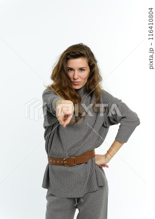 The woman points her finger straight ahead. 116410804