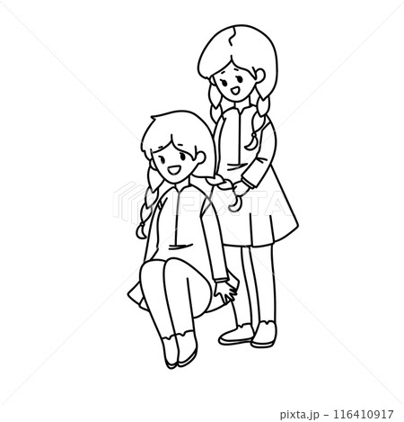 Two girls are sitting on the ground Two girls are sitting on the ground 116410917