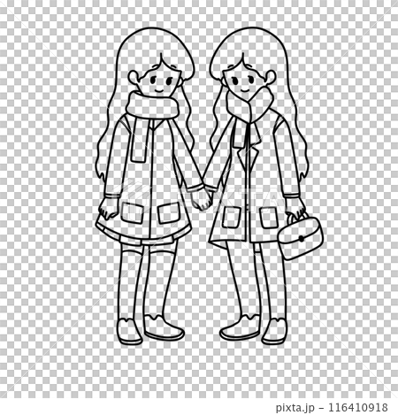 Two girls are holding hands and wearing winter coats 116410918
