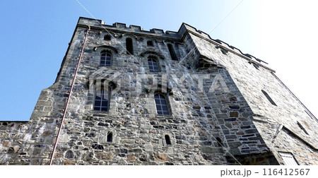 Bergenhus Fortress architecture with blue sky in Bergen, Norway. Bergenhus Fortress architecture with blue sky in Bergen, Norway. 116412567